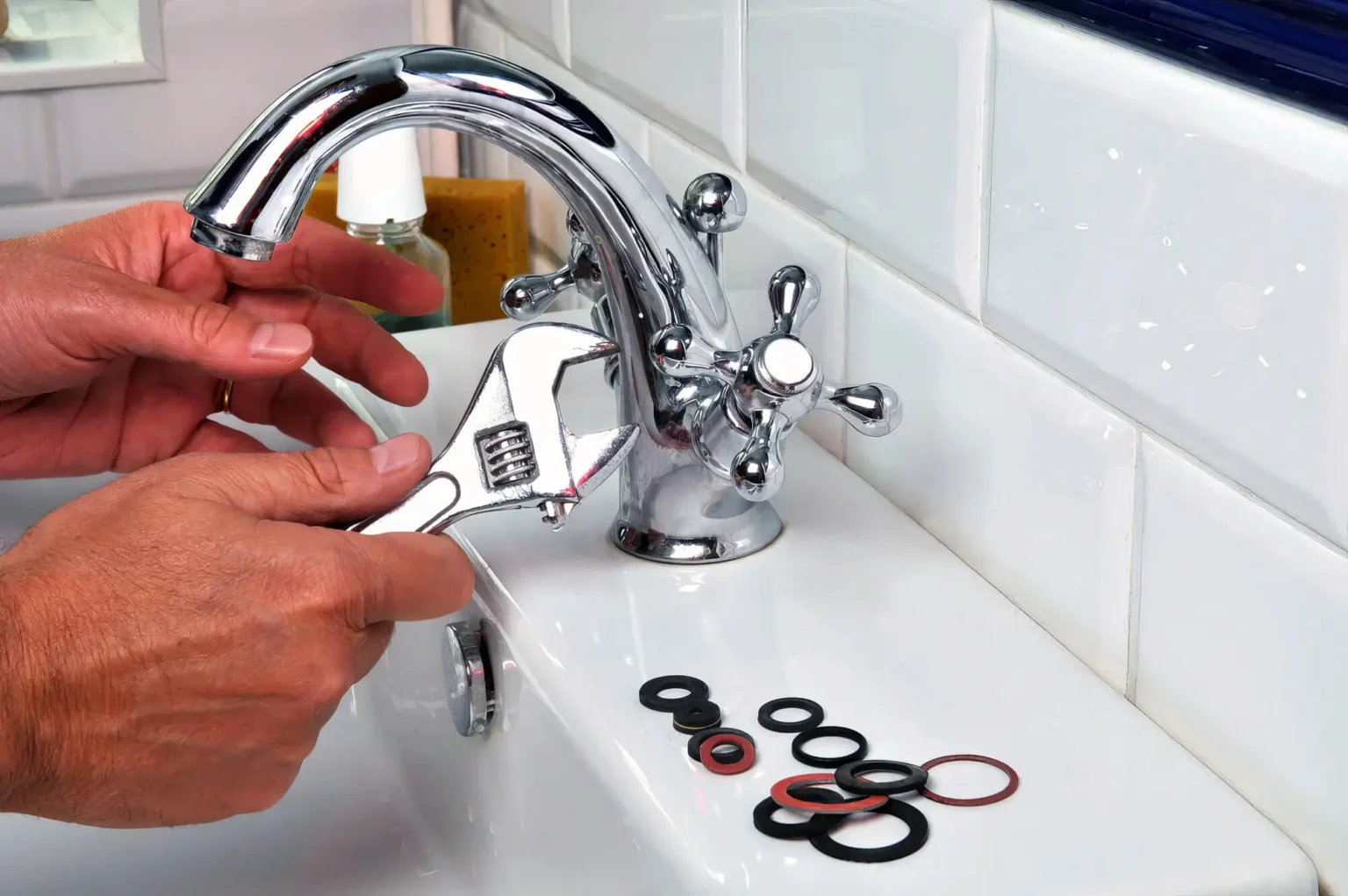 Plumber maintaining a bathroom faucet in San Carlos